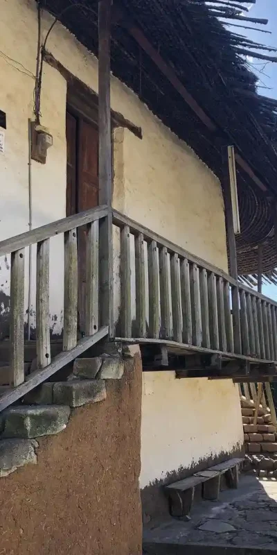 A traditional building with a thatched roof, located by the Entoto, Old Palace of Menelik II in Addis Ababa.