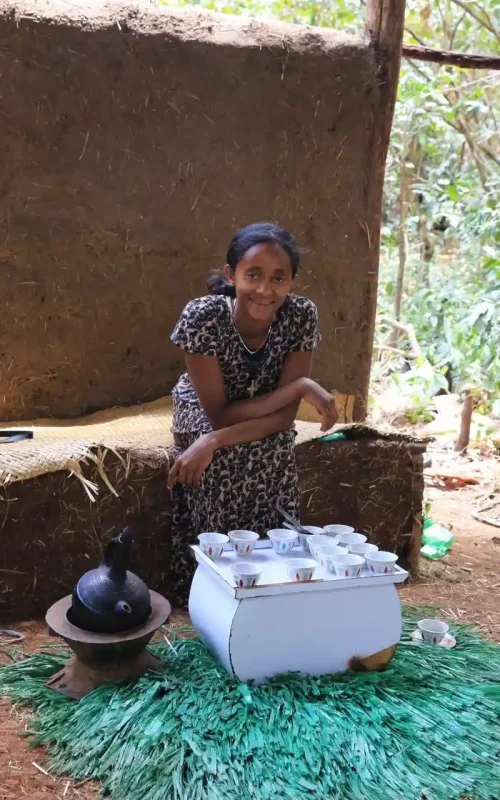 This is the "coffee lady" near Azwa Mariam Monastery on Lake Tana in Ethiopia, preparing for a coffee ceremony.