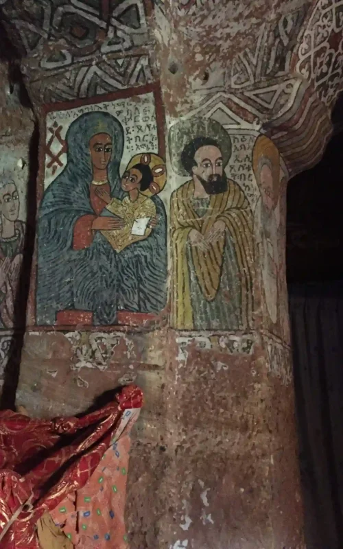 A view of the wall art inside Abune Yemata Guh church, showcasing its intricate details.